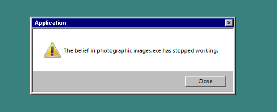 Image displays an error message from the Windows 95 operating system. The text reads ‘The belief in photographic images.exe has stopped working’. 