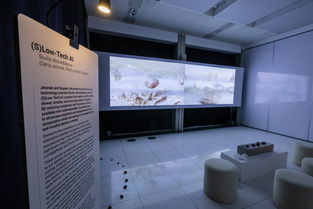 S(low) tech AI installation which shows the projection of an wintery landscape with the exhibition description in shot too. 