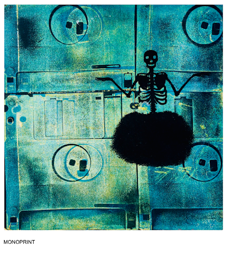 A blue, metallic-like background with a skull spray-painted onto the top. The bottom of the skull is just a black smudge. 